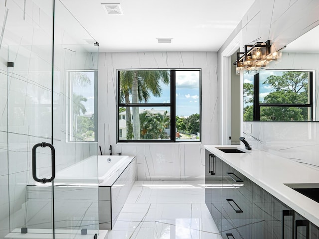 full bath with a bath, visible vents, double vanity, and a stall shower
