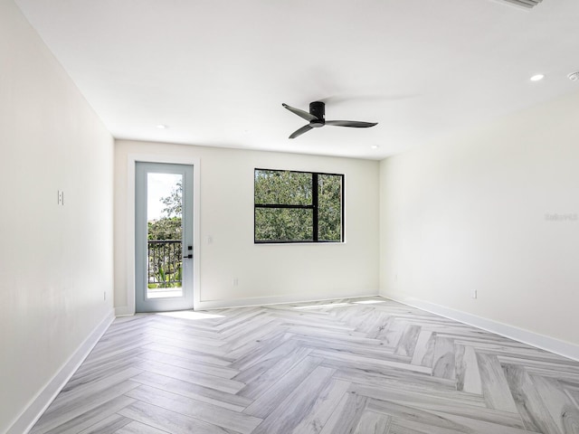 spare room with plenty of natural light, baseboards, and ceiling fan