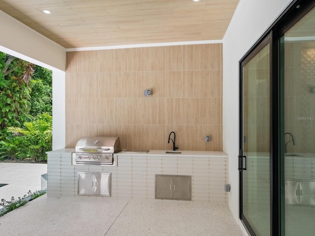 view of patio / terrace with a grill and exterior kitchen
