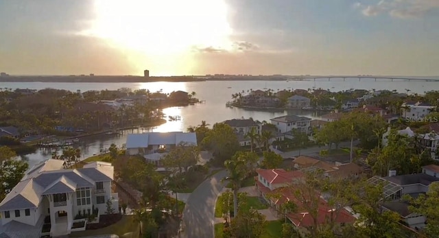 drone / aerial view featuring a residential view and a water view