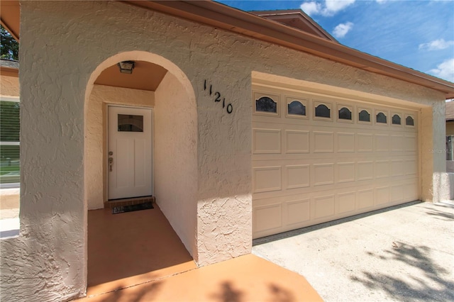 11210 Wheeling Dr, Tampa, FL 33625 - doorway to property with stucco siding