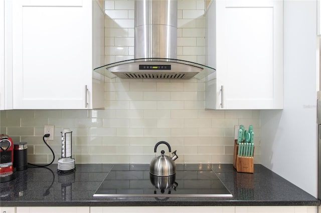 11210 Wheeling Dr, Tampa, FL 33625 - kitchen featuring ventilation hood, tasteful backsplash, white cabinets, and black electric stovetop