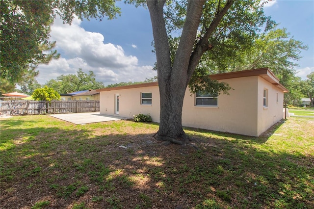 11210 Wheeling Dr, Tampa, FL 33625 - back of property with a patio and stucco siding