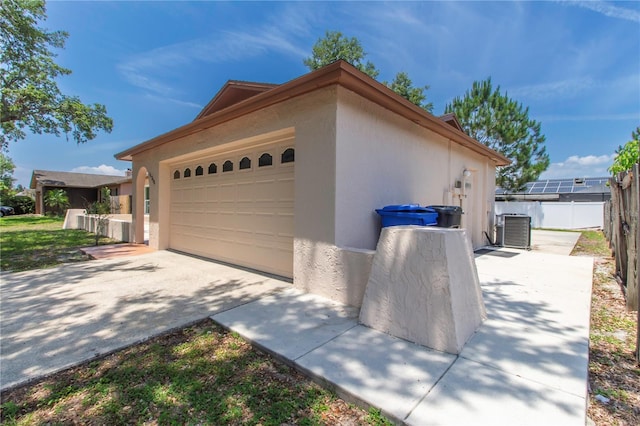 11210 Wheeling Dr, Tampa, FL 33625 - garage featuring central AC