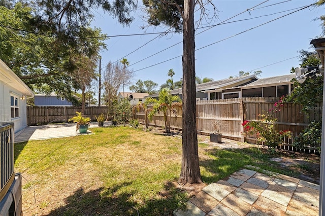 view of yard featuring a patio area and a fenced backyard