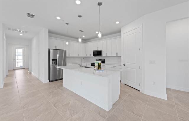 17200 Luminous Ave, Venice, FL 34293 - kitchen with appliances with stainless steel finishes, a sink, light countertops, white cabinets, and recessed lighting