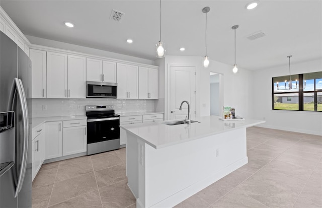 17200 Luminous Ave, Venice, FL 34293 - kitchen with stainless steel appliances, a sink, backsplash, recessed lighting, and light countertops