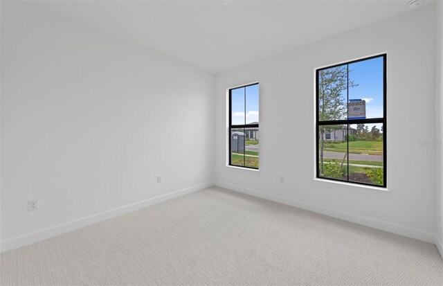 17200 Luminous Ave, Venice, FL 34293 - spare room with light colored carpet and baseboards
