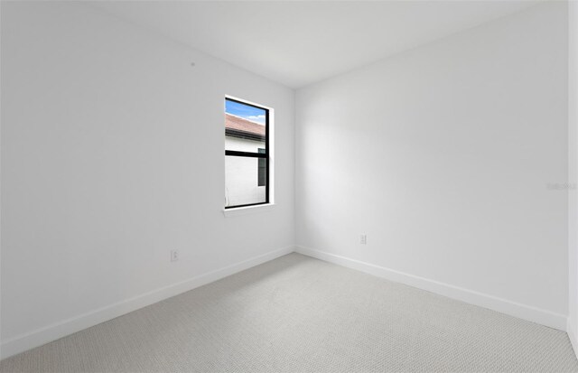 17200 Luminous Ave, Venice, FL 34293 - unfurnished room with light carpet and baseboards