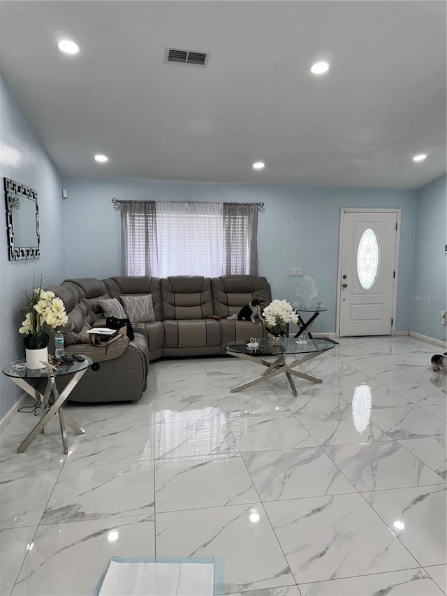living room featuring visible vents, recessed lighting, marble finish floor, and baseboards
