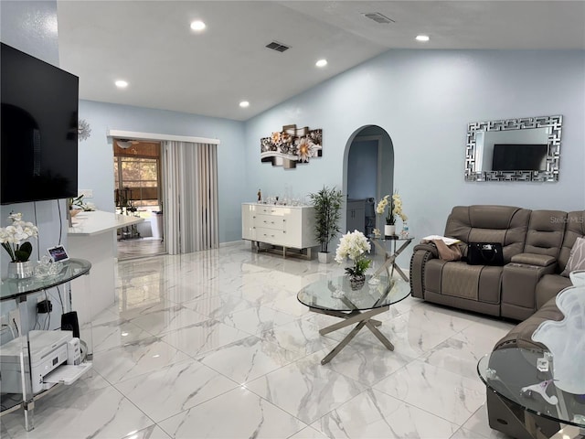 living room with arched walkways, marble finish floor, recessed lighting, vaulted ceiling, and visible vents