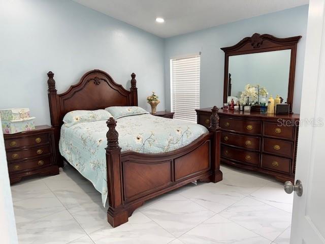 bedroom with recessed lighting