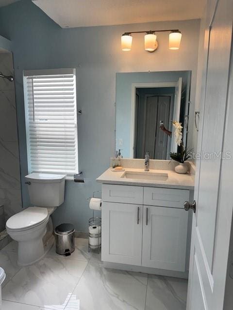 bathroom featuring a shower, vanity, baseboards, toilet, and marble finish floor
