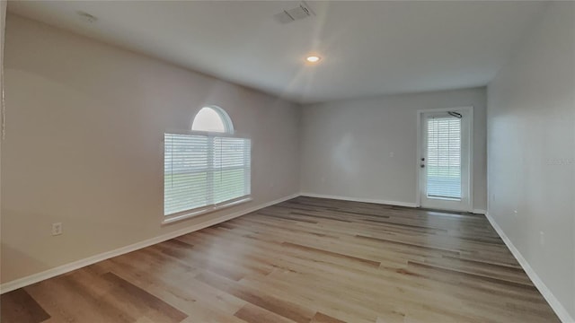 105 Evergreen Dr, Auburndale, FL 33823 - empty room featuring visible vents, wood finished floors, baseboards, and recessed lighting