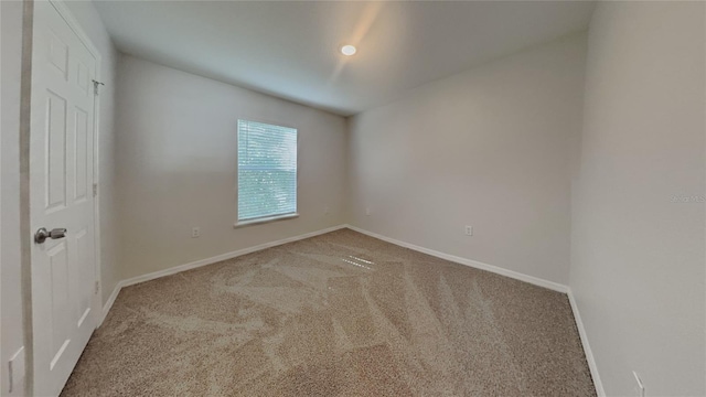 105 Evergreen Dr, Auburndale, FL 33823 - spare room featuring carpet and baseboards