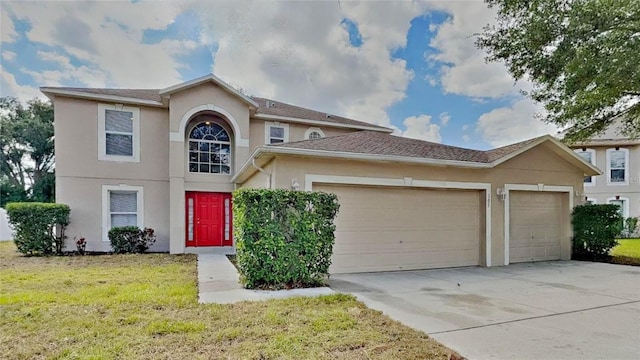 105 Evergreen Dr, Auburndale, FL 33823 - traditional-style home featuring stucco siding, an attached garage, concrete driveway, and a front lawn