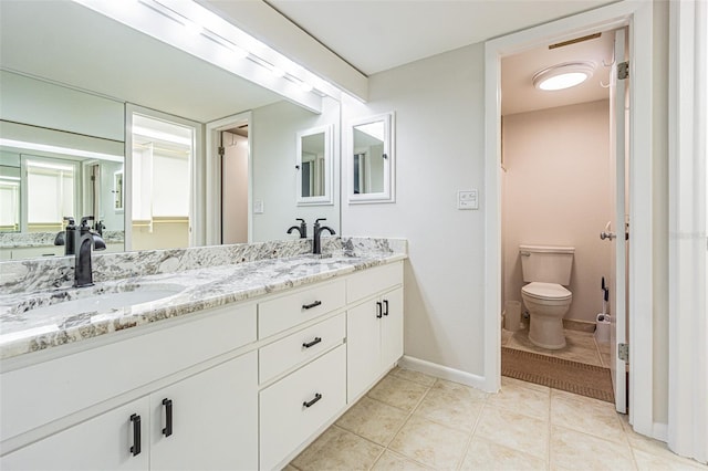 4137 Northmeadow Cir, Tampa, FL 33618 - full bath featuring toilet, tile patterned floors, a sink, and double vanity