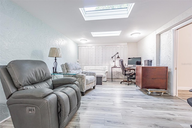 4137 Northmeadow Cir, Tampa, FL 33618 - home office featuring a skylight, a textured wall, and light wood finished floors