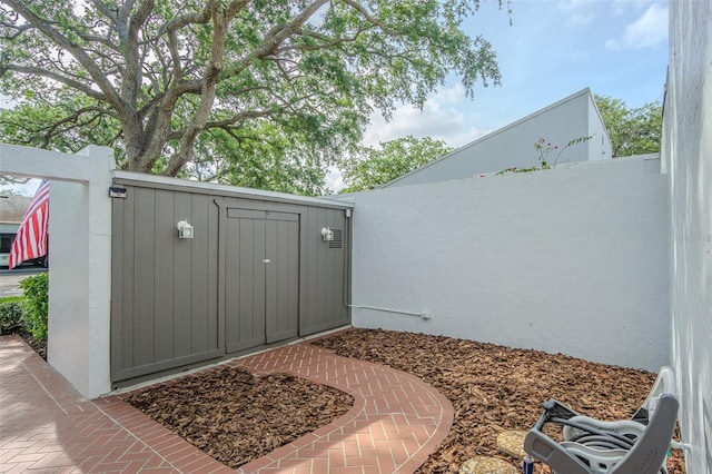 4137 Northmeadow Cir, Tampa, FL 33618 - exterior space with a storage unit and an outbuilding