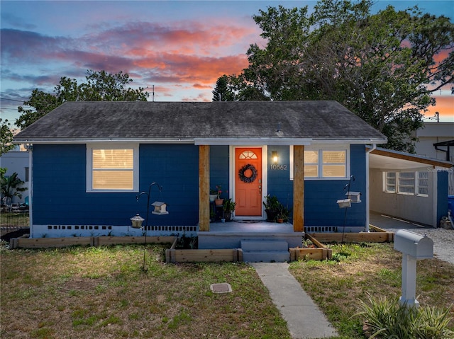 bungalow-style house with a shingled roof