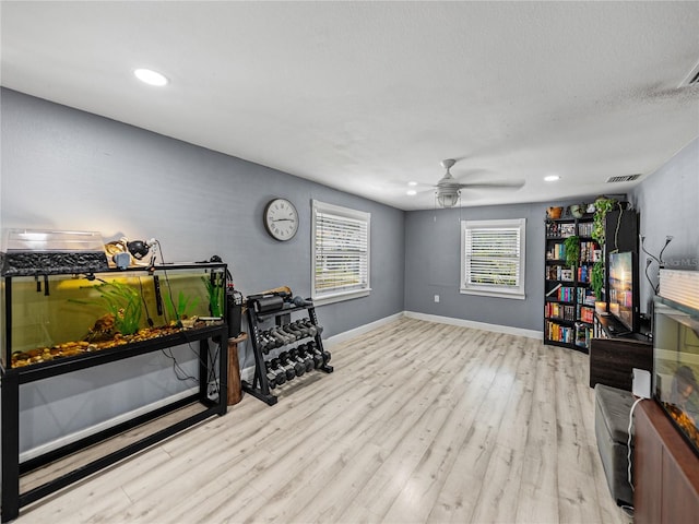 sitting room featuring recessed lighting, a ceiling fan, visible vents, baseboards, and wood finished floors