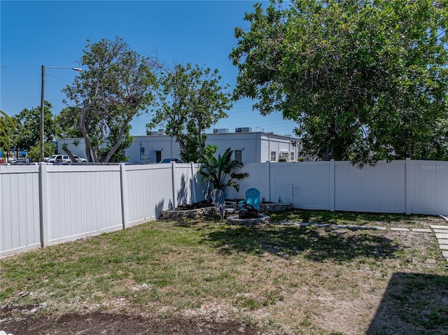 view of yard with a fenced backyard