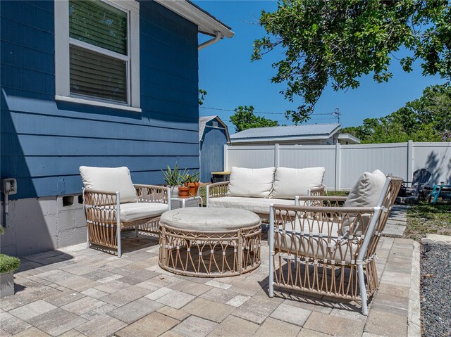 view of patio / terrace with fence and an outdoor hangout area