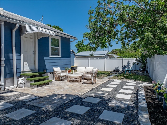view of patio with outdoor lounge area and a fenced backyard