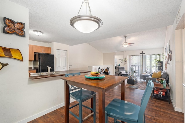 5636 Baywater Dr Unit 5636, Tampa, FL 33615 - dining space with dark wood-type flooring, a ceiling fan, a textured ceiling, and baseboards