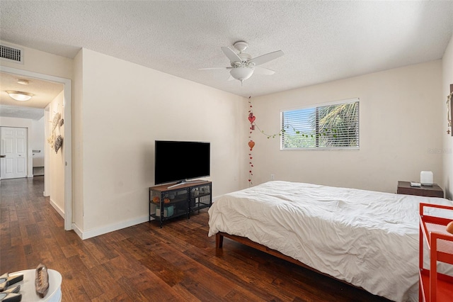 5636 Baywater Dr Unit 5636, Tampa, FL 33615 - bedroom with wood finished floors, baseboards, visible vents, a ceiling fan, and a textured ceiling