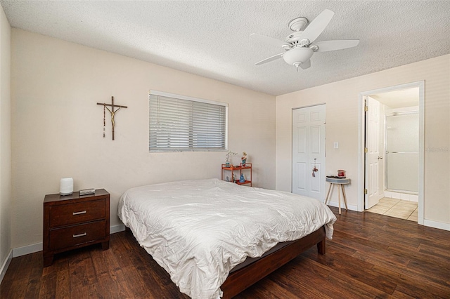 5636 Baywater Dr Unit 5636, Tampa, FL 33615 - bedroom featuring baseboards, a textured ceiling, and wood-type flooring