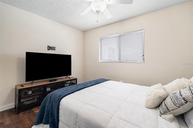 5636 Baywater Dr Unit 5636, Tampa, FL 33615 - bedroom featuring baseboards, wood finished floors, ceiling fan, and a textured ceiling
