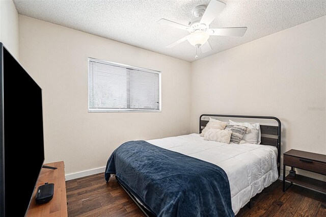 5636 Baywater Dr Unit 5636, Tampa, FL 33615 - bedroom featuring a textured ceiling, wood finished floors, ceiling fan, and baseboards