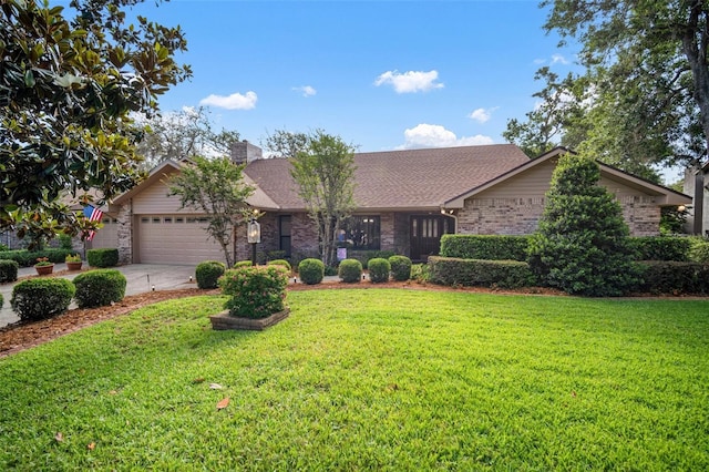 single story home featuring brick siding, a garage, a front lawn, and driveway