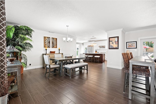 6129 Leeland St S, Saint Petersburg, FL 33715 - dining space featuring baseboards, a chandelier, and ornamental molding