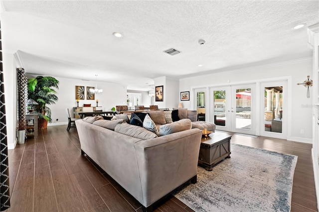 6129 Leeland St S, Saint Petersburg, FL 33715 - living area featuring dark wood-type flooring, crown molding, a textured ceiling, and visible vents