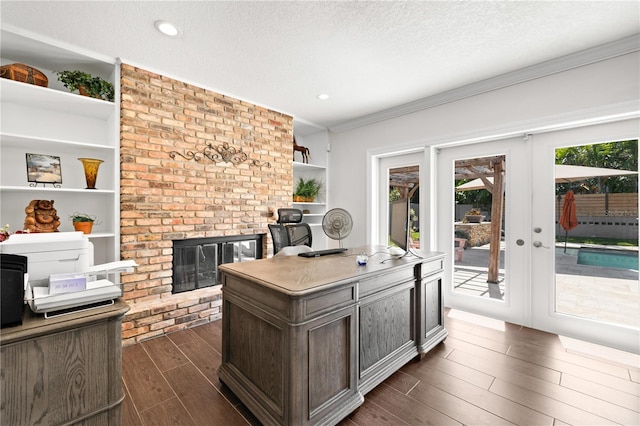 6129 Leeland St S, Saint Petersburg, FL 33715 - office with dark wood-type flooring, a wealth of natural light, crown molding, and a fireplace