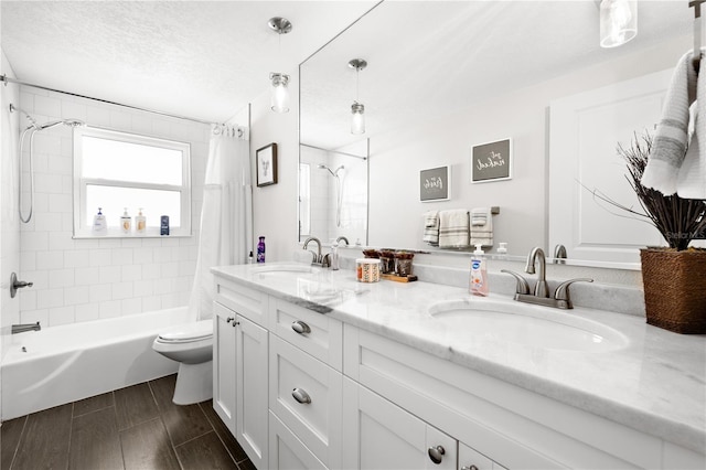 6129 Leeland St S, Saint Petersburg, FL 33715 - full bathroom with double vanity, shower / tub combo with curtain, toilet, and a sink