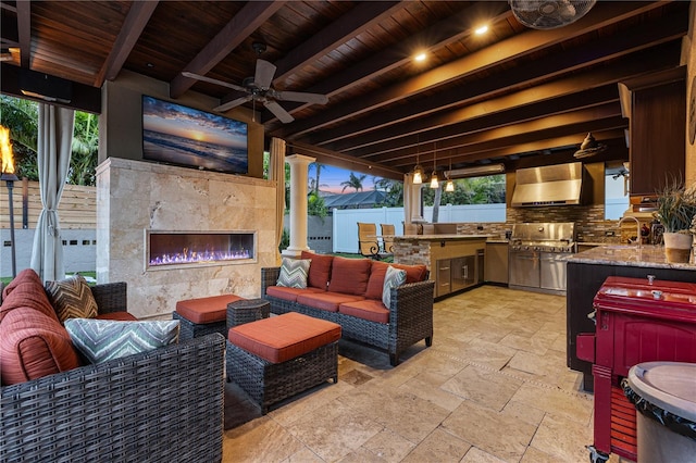 6129 Leeland St S, Saint Petersburg, FL 33715 - view of patio / terrace featuring fence, a ceiling fan, an outdoor living space with a fireplace, and exterior kitchen