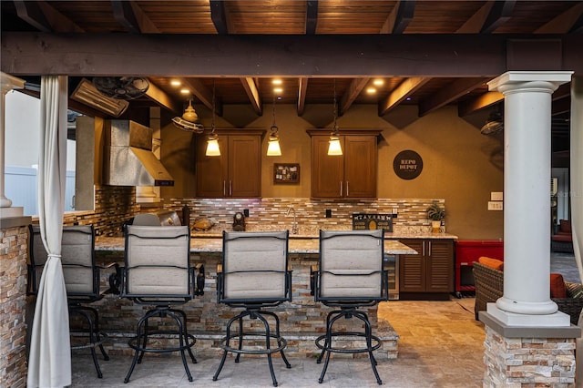 6129 Leeland St S, Saint Petersburg, FL 33715 - bar featuring wood ceiling, pendant lighting, backsplash, beam ceiling, and ornate columns