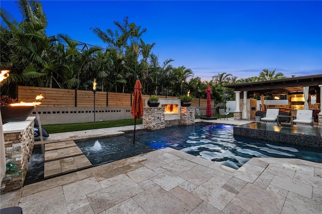6129 Leeland St S, Saint Petersburg, FL 33715 - view of pool with a fenced backyard, an outdoor kitchen, a patio, and a fenced in pool