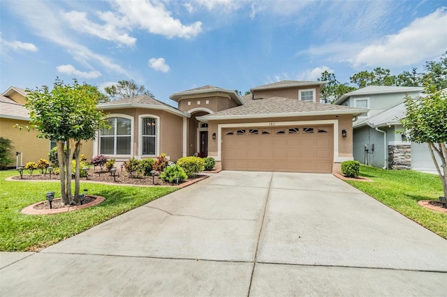 7815 Blue Spring Dr, Land O Lakes, FL 34637 - view of front of home featuring a garage, driveway, a front yard, and stucco siding