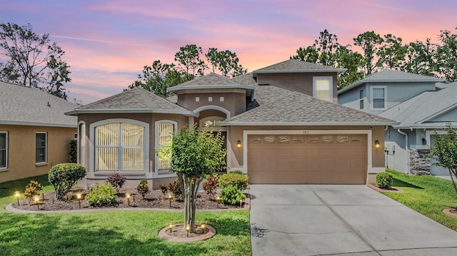 7815 Blue Spring Dr, Land O Lakes, FL 34637 - view of front of home with stucco siding, driveway, a lawn, roof with shingles, and a garage