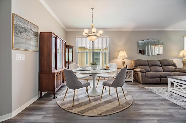 7815 Blue Spring Dr, Land O Lakes, FL 34637 - dining space with an inviting chandelier, crown molding, dark wood-type flooring, and baseboards