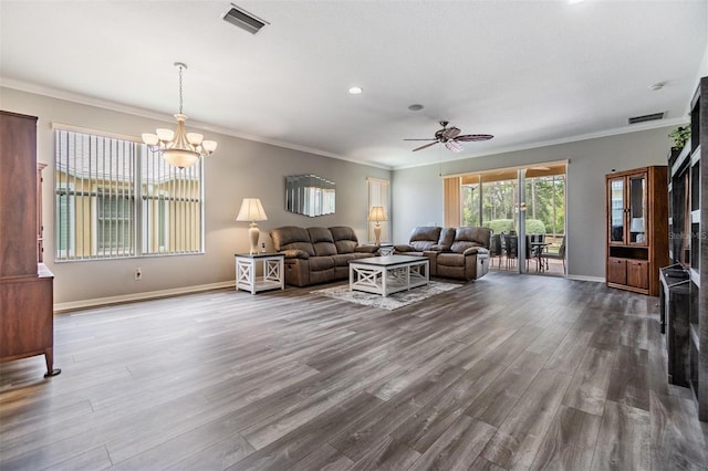 7815 Blue Spring Dr, Land O Lakes, FL 34637 - living room featuring baseboards, visible vents, dark wood-style floors, and ornamental molding