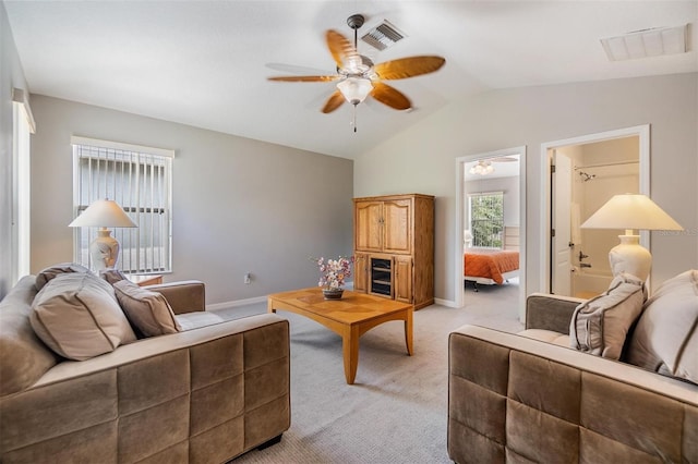 7815 Blue Spring Dr, Land O Lakes, FL 34637 - living room with light colored carpet, lofted ceiling, a ceiling fan, and visible vents