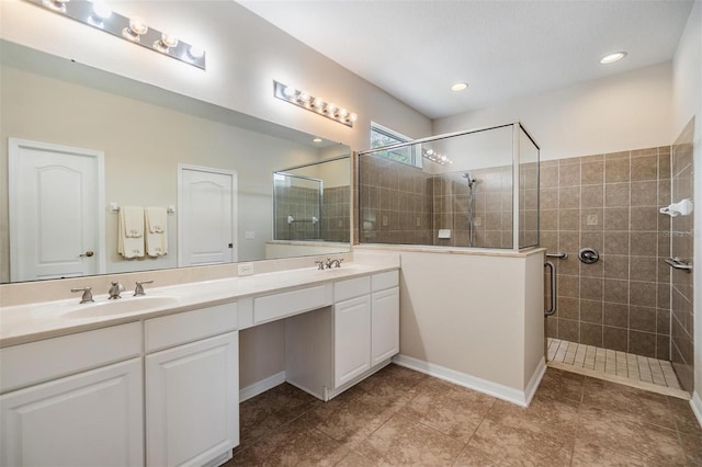 7815 Blue Spring Dr, Land O Lakes, FL 34637 - bathroom featuring double vanity, a stall shower, and a sink