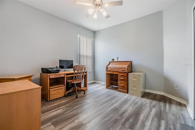 7815 Blue Spring Dr, Land O Lakes, FL 34637 - home office with wood finished floors, baseboards, and ceiling fan