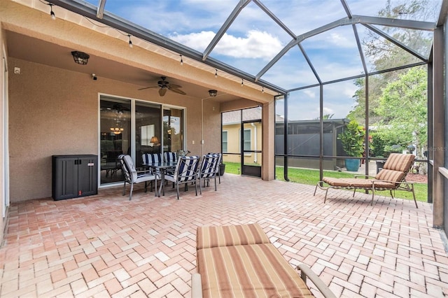 7815 Blue Spring Dr, Land O Lakes, FL 34637 - view of patio / terrace with a lanai, outdoor dining area, and ceiling fan