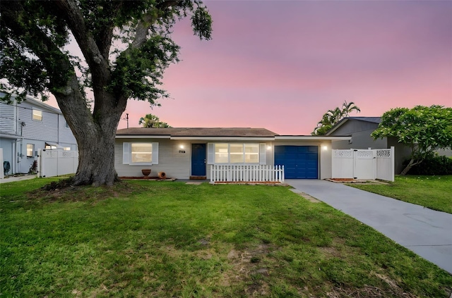 250 W Canal Dr, Palm Harbor, FL 34684 - ranch-style house with concrete driveway and an attached garage